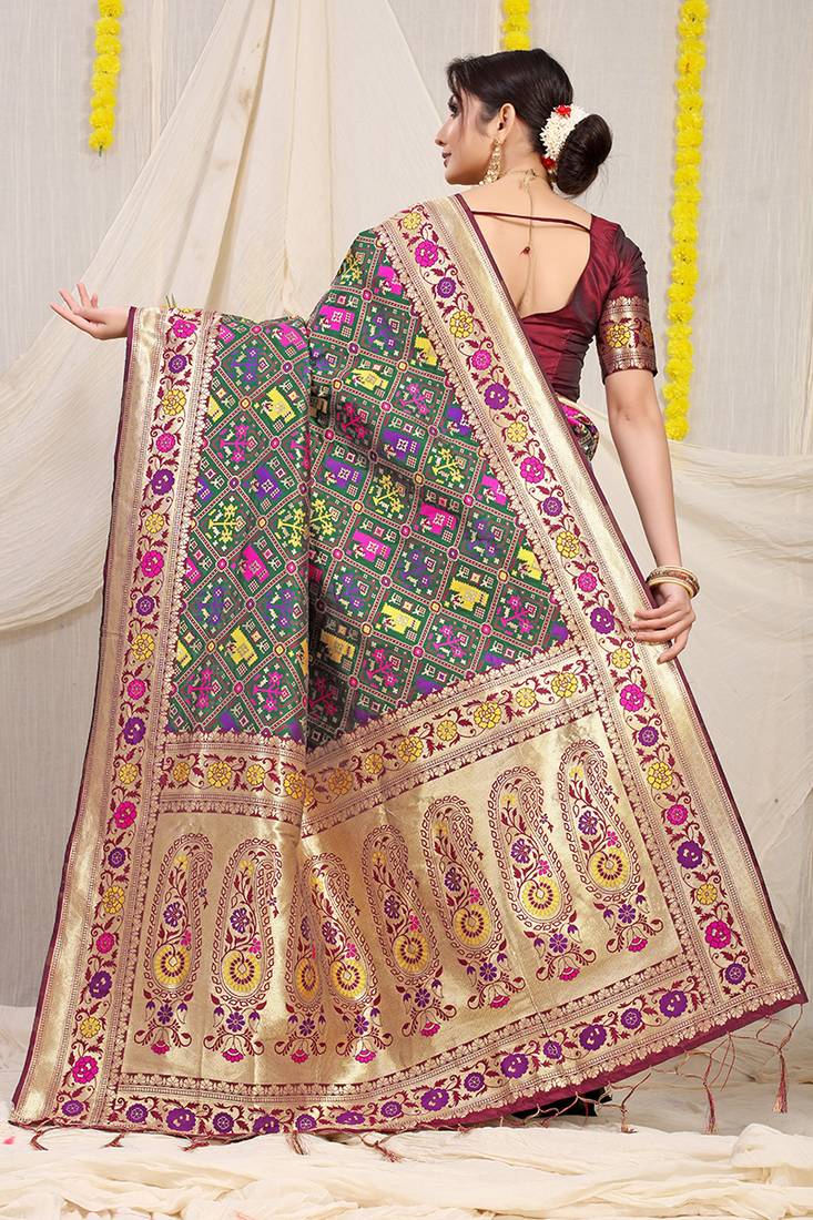 Dark green patola silk blend saree with blouse piece