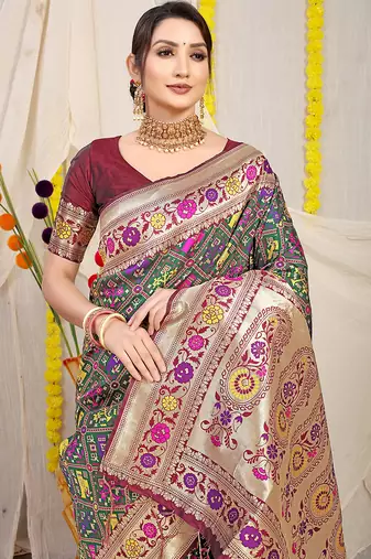 Dark green patola silk blend saree with blouse piece