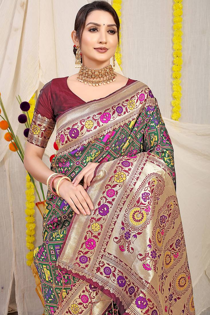 Dark green patola silk blend saree with blouse piece