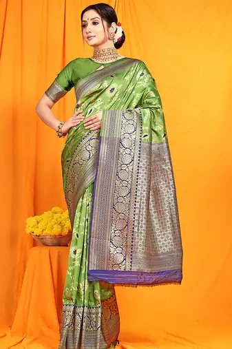 Light green banarasi silk blend saree with zari woven border