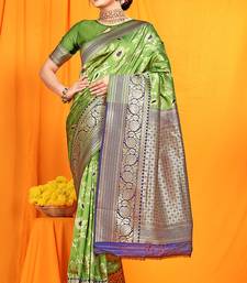 Light green banarasi silk blend saree with zari woven border