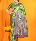 Light green banarasi silk blend saree with zari woven border