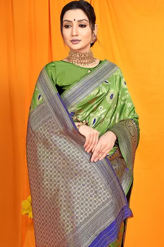 Light green banarasi silk blend saree with zari woven border
