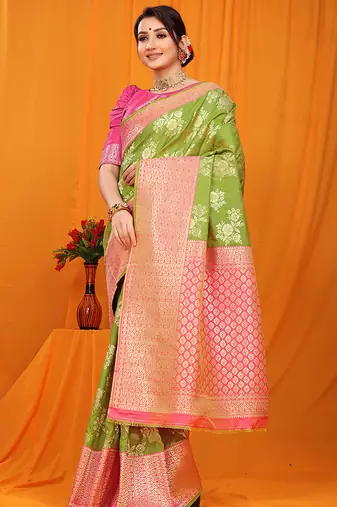 Light green banarasi silk blend saree with pink zari woven border