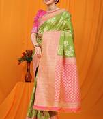 Light green banarasi silk blend saree with pink zari woven border