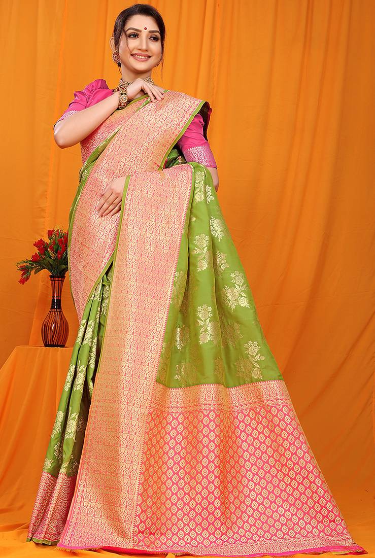 Light green banarasi silk blend saree with pink zari woven border