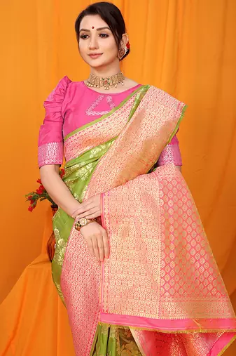 Light green banarasi silk blend saree with pink zari woven border