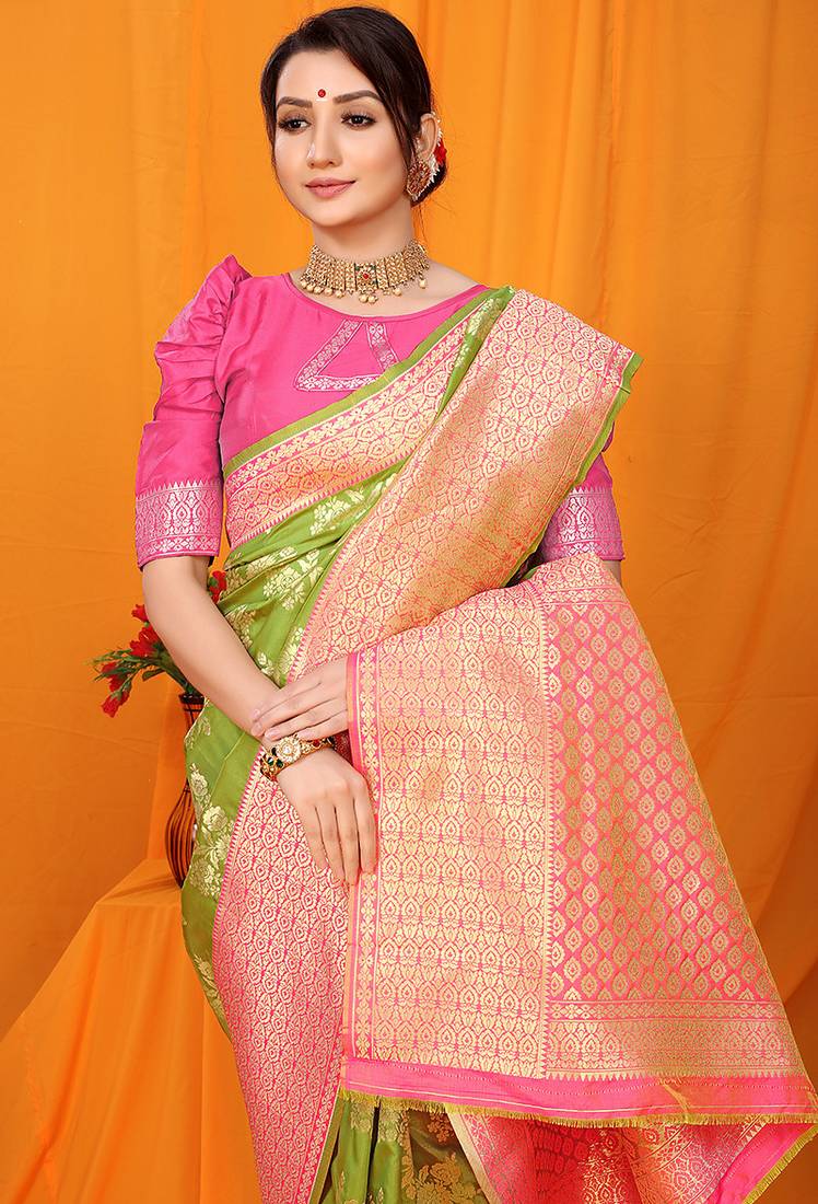 Light green banarasi silk blend saree with pink zari woven border