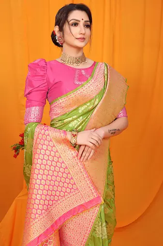 Light green banarasi silk blend saree with pink zari woven border