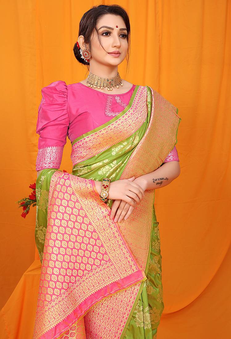 Light green banarasi silk blend saree with pink zari woven border