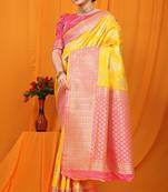 Yellow banarasi silk blend saree with pink zari woven border