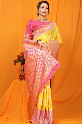 Yellow banarasi silk blend saree with pink zari woven border