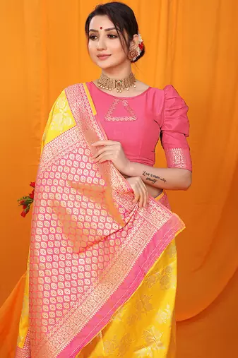 Yellow banarasi silk blend saree with pink zari woven border