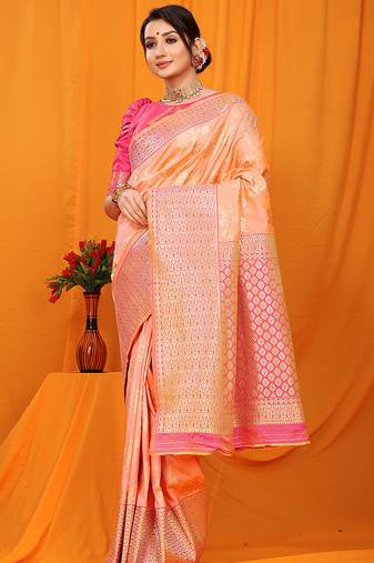 Peach banarasi silk blend saree with pink zari woven border