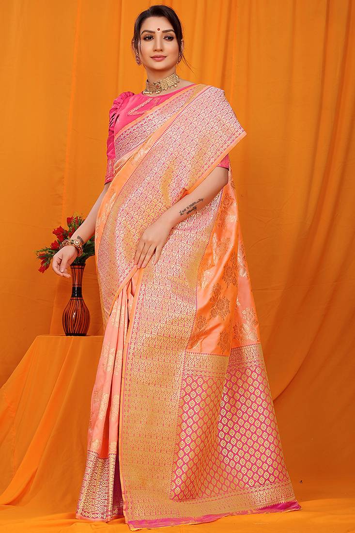 Peach banarasi silk blend saree with pink zari woven border