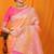 Peach banarasi silk blend saree with pink zari woven border