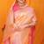 Peach banarasi silk blend saree with pink zari woven border