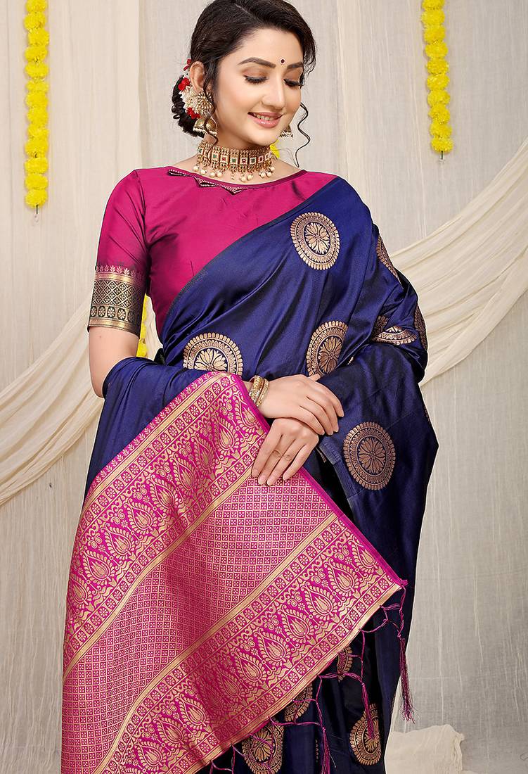 Navy blue silk blend saree with teal zari border and circular motifs