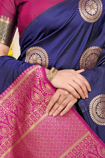 Navy blue silk blend saree with teal zari border and circular motifs