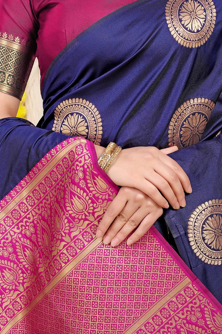 Navy blue silk blend saree with teal zari border and circular motifs