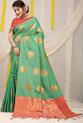 Sea green silk blend saree with pink zari border and circular motifs 1