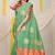 Sea green silk blend saree with pink zari border and circular motifs