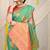 Sea green silk blend saree with pink zari border and circular motifs