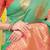 Sea green silk blend saree with pink zari border and circular motifs