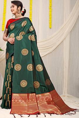 Bottle green silk blend saree with red zari border and circular motifs 1