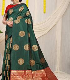 Bottle green silk blend saree with red zari border and circular motifs