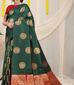 Bottle green silk blend saree with red zari border and circular motifs