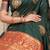 Bottle green silk blend saree with red zari border and circular motifs