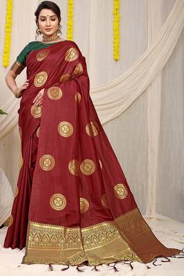 Maroon silk blend saree with dark green zari border and circular motifs 1