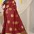 Maroon silk blend saree with dark green zari border and circular motifs