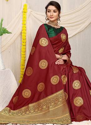 Maroon silk blend saree with dark green zari border and circular motifs 2