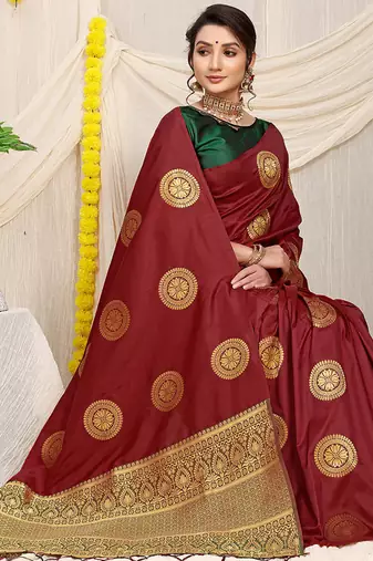 Maroon silk blend saree with dark green zari border and circular motifs