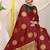 Maroon silk blend saree with dark green zari border and circular motifs