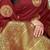 Maroon silk blend saree with dark green zari border and circular motifs