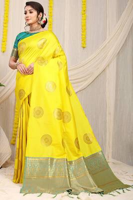 Yellow silk blend saree with teal zari border and circular motifs 1