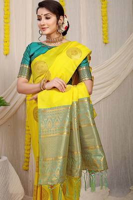 Yellow silk blend saree with teal zari border and circular motifs 3