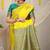 Yellow silk blend saree with teal zari border and circular motifs