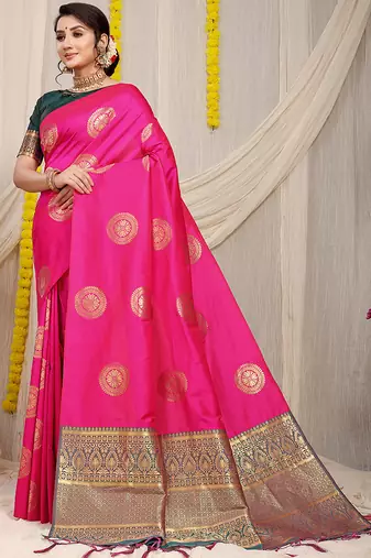 Rani pink silk blend saree with bottle green zari border and circular motifs