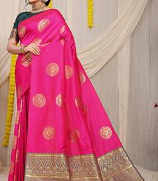 Rani pink silk blend saree with bottle green zari border and circular motifs