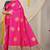 Rani pink silk blend saree with bottle green zari border and circular motifs
