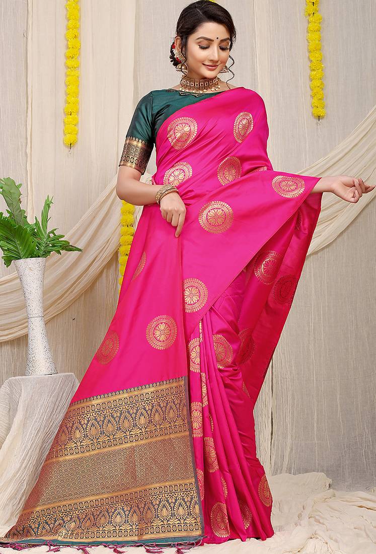 Rani pink silk blend saree with bottle green zari border and circular motifs