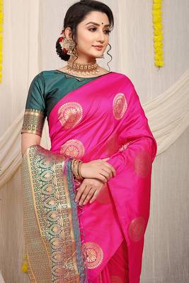 Rani pink silk blend saree with bottle green zari border and circular motifs 3