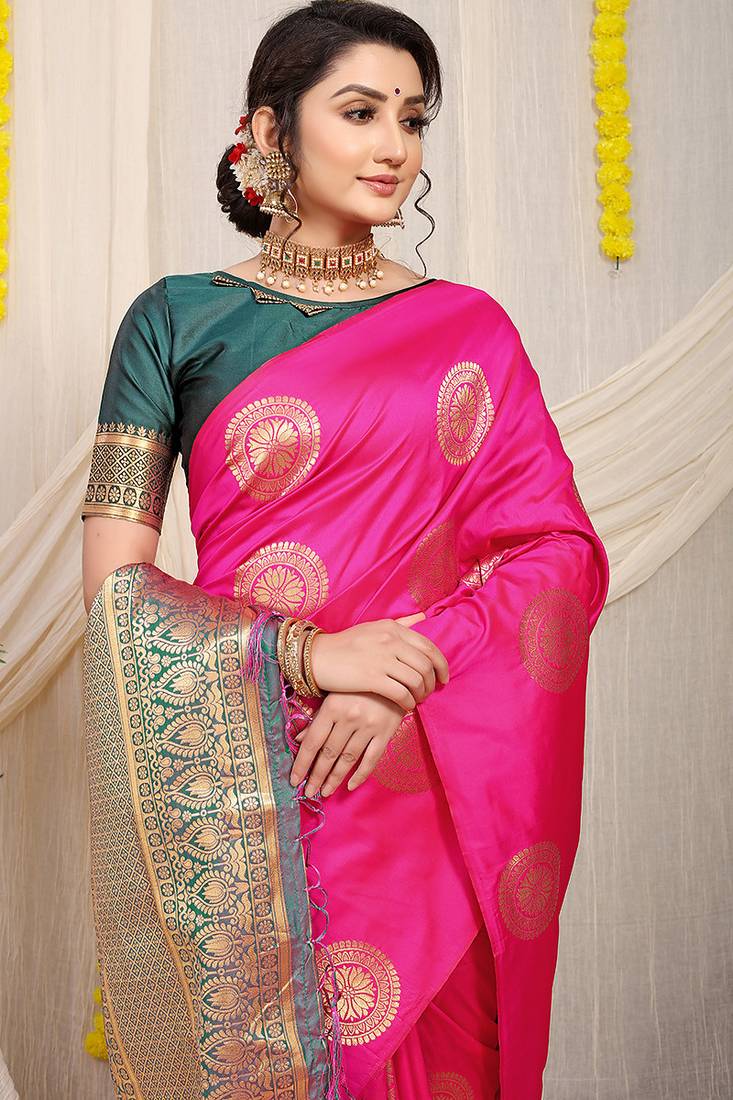 Rani pink silk blend saree with bottle green zari border and circular motifs