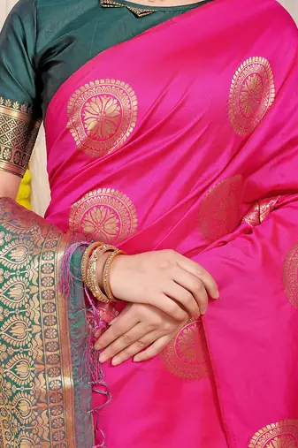 Rani pink silk blend saree with bottle green zari border and circular motifs