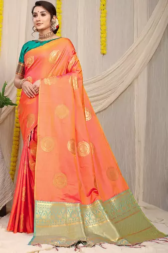 Peach silk blend saree with turquoise zari border and circular motifs