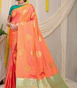 Peach silk blend saree with turquoise zari border and circular motifs